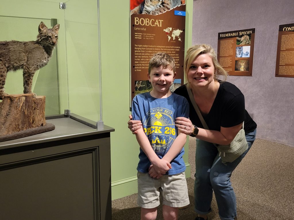 Mother and son pose in Cats Untamed by the bobcat