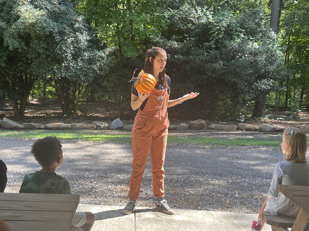MC cox teaching kids at pumpkin patch program