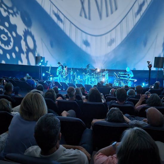 fans enjoying live music in the planetarium