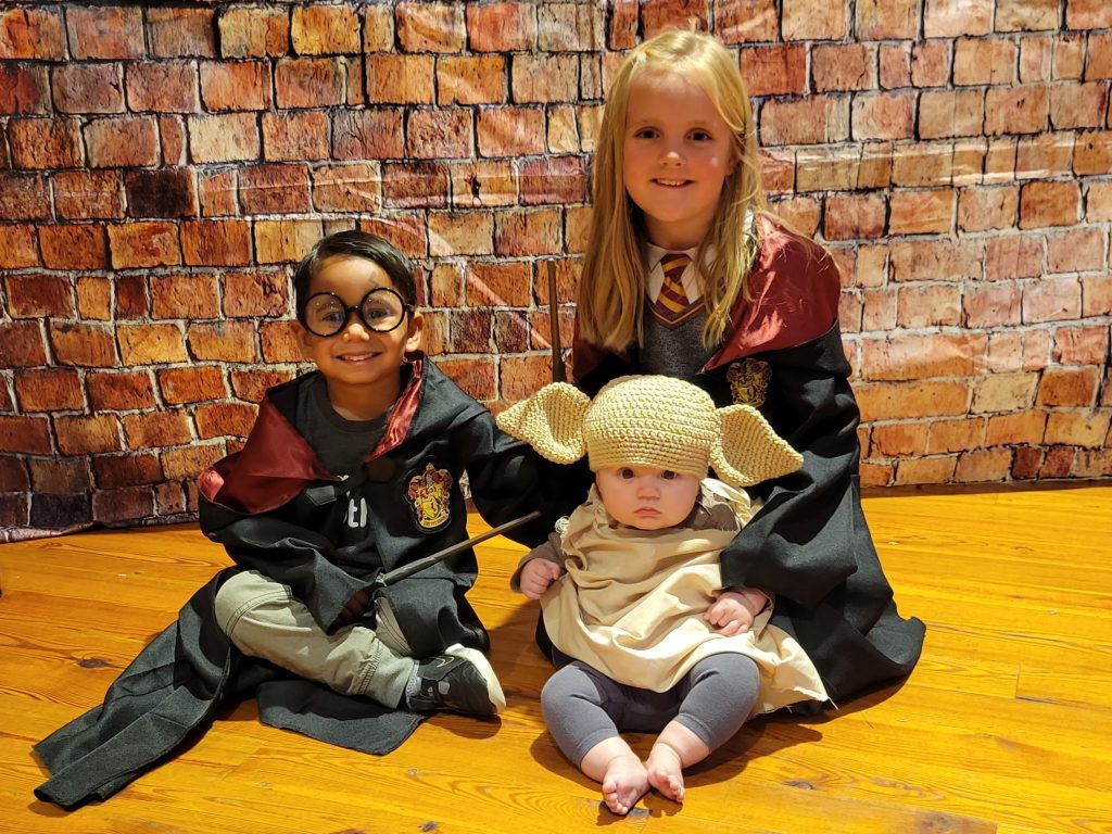 Photograph of 3 kids in Harry Potter Costume and Baby Yoda costume