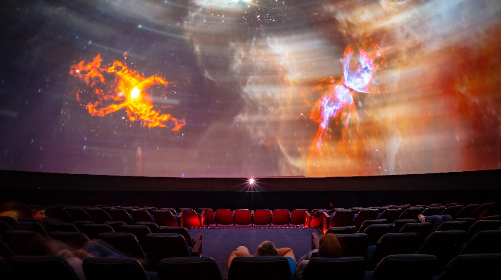 Photograph of the planetarium displaying graphics of the galaxy