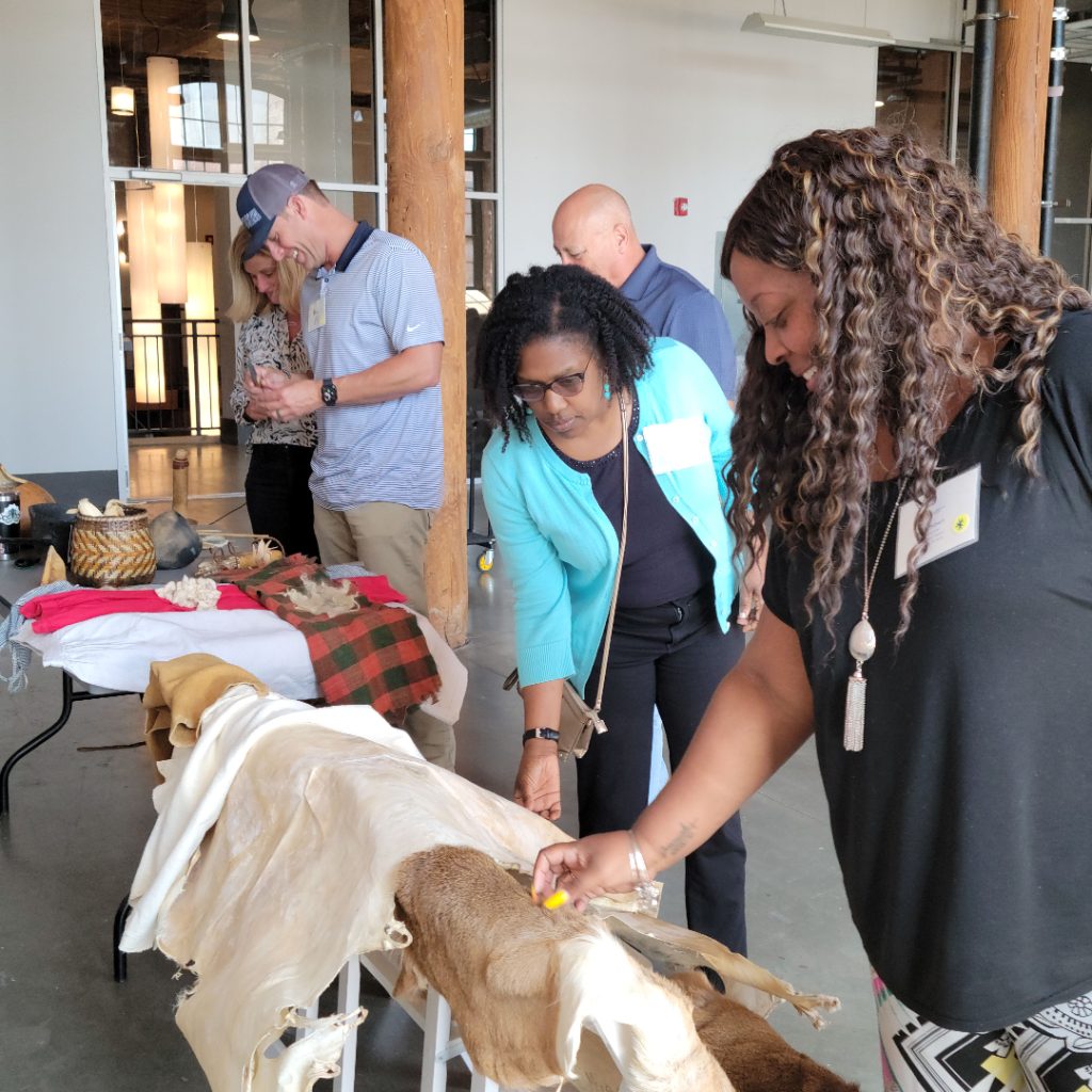 Adults caressing the animal pelts