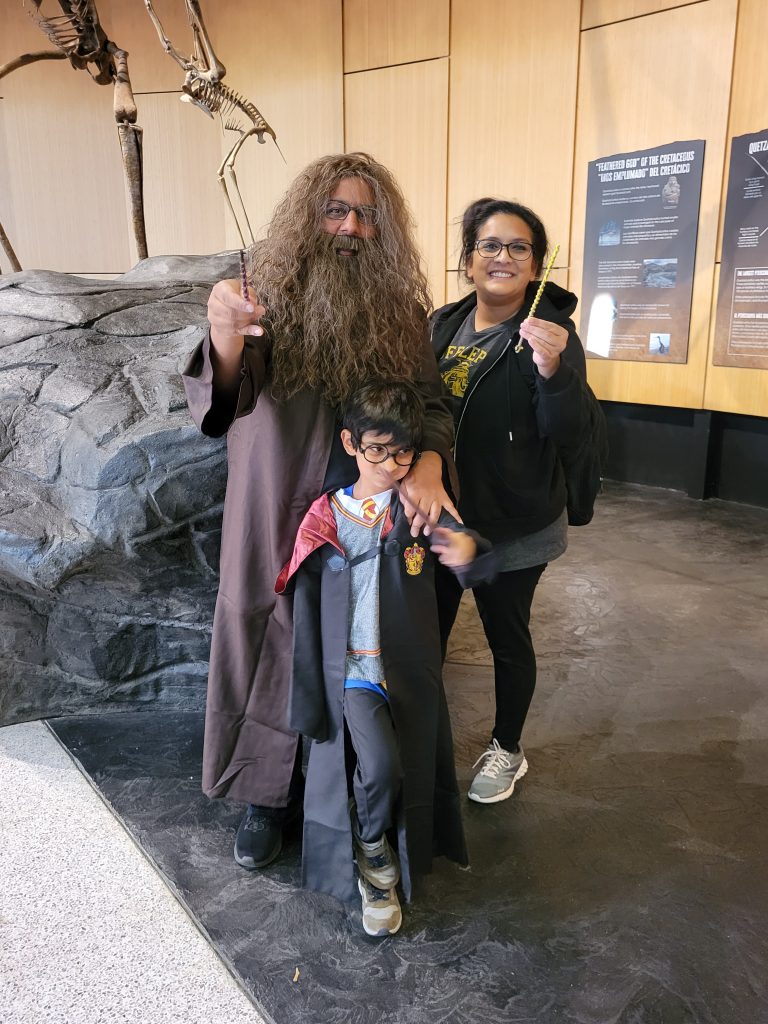 Photograph of a family in costumes from Harry Potter