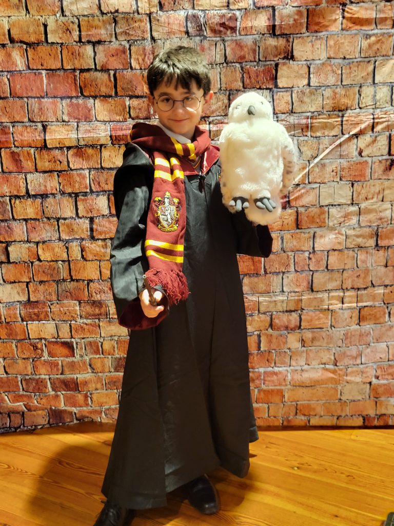 Photograph of a kid dressed as Harry Potter