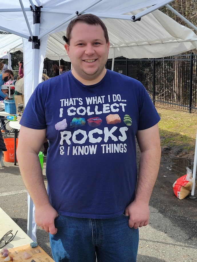 Picture of a man wearing a shirt with text saying That's What I do... I Collect Rocks & I Know Things