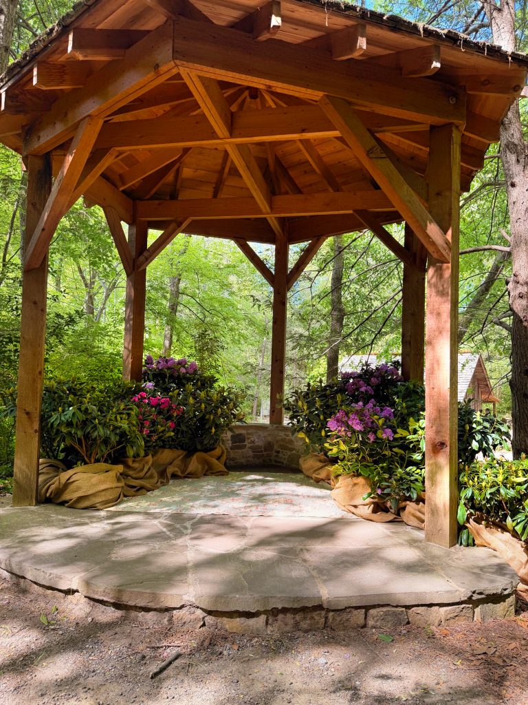 Empty gazebo in the Memorial Garden filled with flowers