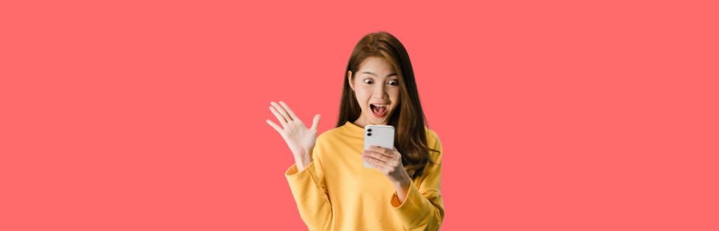girl with shocked face looking at her cell phone