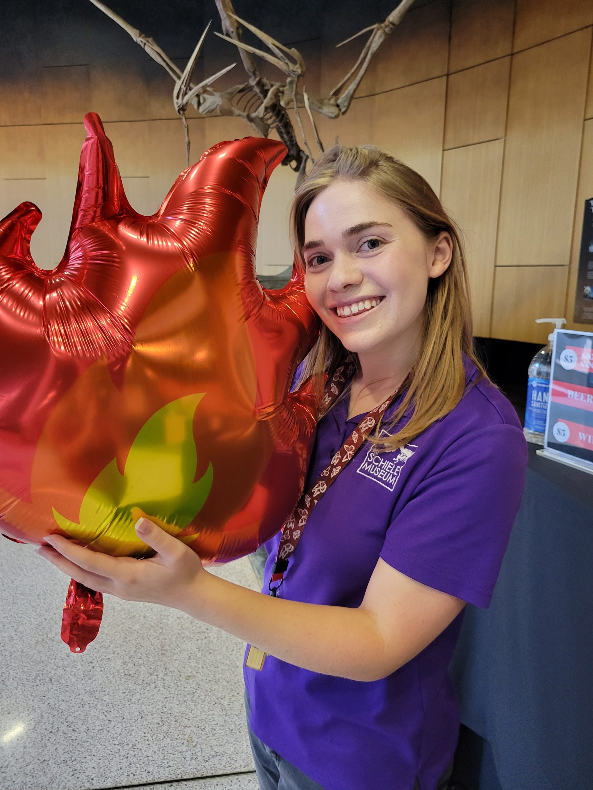 Schiele staff holding a fire-shaped balloon
