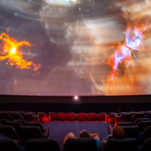 Photograph of the planetarium displaying graphics of the galaxy